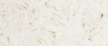 an Akoya countertop surface that features swirls of cream and vanilla