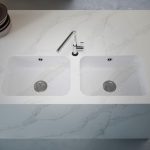 a double sink over the Et Calacatta Gold countertop surface