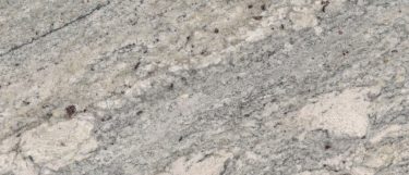 an African Rainbow granite countertop surface that features multi-colored veining in beige, light gray, russet, and blue