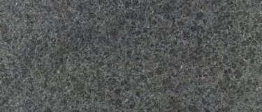 an Absolute Black granite countertop surface that has an intense black color with subtle speck details