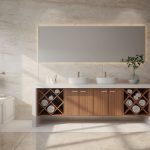an elegant bathroom with an illuminated rectangular mirror, two vessel sinks over the white bath counters with a wooden cabinet base that has rolled towel cloths, a bathtub, a white toilet bowl, and a Stonika Arga flooring and walls