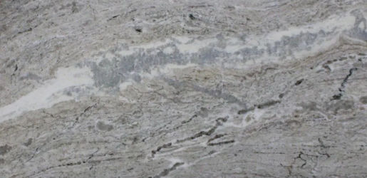 a gray stone with different shades of beige and gray blended in a swirling and veining pattern